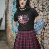 Woman in black cat t-shirt and plaid skirt